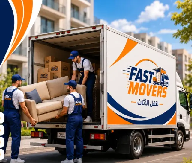 Workers carrying a sofa to a closed moving truck