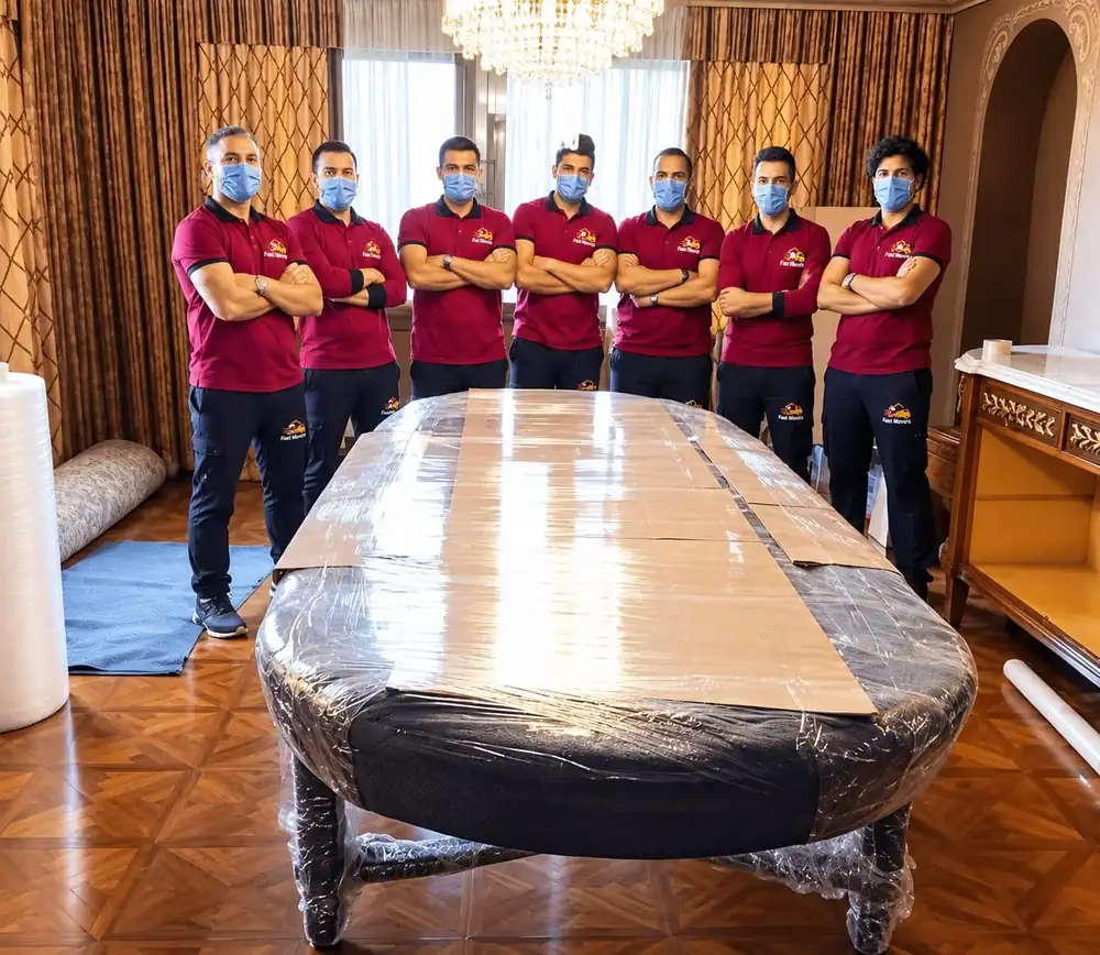 The Fast Movers team in uniform with a fully wrapped table behind them